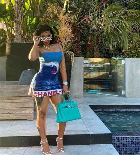 Chanel Surf Dress and CC Logo Sunglasses Worn By Cardi B